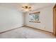 Bedroom with a ceiling fan, one window, and neutral carpet at 10436 W 84Th Pl, Arvada, CO 80005