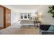 Sunlit bedroom with three windows, cozy chair, and a queen-sized bed, perfect for relaxation at 10436 W 84Th Pl, Arvada, CO 80005