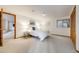 Bedroom with neutral walls and carpet features a large bed, closet and window at 10436 W 84Th Pl, Arvada, CO 80005