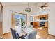 Bright dining area with access to an outdoor deck and kitchen view at 10436 W 84Th Pl, Arvada, CO 80005