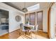 Cozy dining area with hardwood floors and natural light at 10436 W 84Th Pl, Arvada, CO 80005