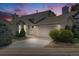 Charming home exterior featuring a two-car garage and well-manicured landscaping at 10436 W 84Th Pl, Arvada, CO 80005