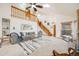 Bright, airy living room with a skylight and comfortable seating arrangements at 10436 W 84Th Pl, Arvada, CO 80005
