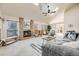 Spacious living room features a brick fireplace and vaulted ceilings with natural light at 10436 W 84Th Pl, Arvada, CO 80005