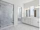 Luxurious bathroom with marble shower and double vanity at 5091 Hickory Oaks St, Castle Rock, CO 80104