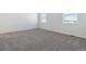 Bright bedroom with neutral carpeting and large windows at 5091 Hickory Oaks St, Castle Rock, CO 80104