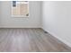 Simple bedroom with neutral walls and wood-look floors at 5091 Hickory Oaks St, Castle Rock, CO 80104
