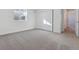 Spacious bedroom featuring carpet, a window, and access to a hallway at 5091 Hickory Oaks St, Castle Rock, CO 80104