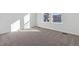 Well-lit bedroom with carpeted floors and large windows at 5091 Hickory Oaks St, Castle Rock, CO 80104
