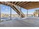 Covered deck with stairs leading to the backyard, offering scenic views at 5091 Hickory Oaks St, Castle Rock, CO 80104