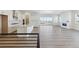 Open concept kitchen with large island and white cabinets at 5091 Hickory Oaks St, Castle Rock, CO 80104