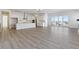 Open living room with hardwood floors and fireplace at 5091 Hickory Oaks St, Castle Rock, CO 80104
