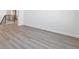 Open living room with wood-look floors and fireplace at 5091 Hickory Oaks St, Castle Rock, CO 80104