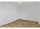 Spacious, minimalist bedroom with wood floors and a closet at 1260 Ascot Ave, Highlands Ranch, CO 80126