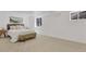 Well-lit bedroom with an upholstered bed frame and neutral decor at 1260 Ascot Ave, Highlands Ranch, CO 80126