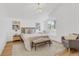 Bright bedroom with a plush rug, accent chair and window seat at 1260 Ascot Ave, Highlands Ranch, CO 80126