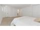 Neutral bedroom featuring a large bed and multiple closets at 1260 Ascot Ave, Highlands Ranch, CO 80126