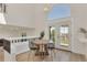 Chic dining area with modern furnishings and a large window with natural light at 1260 Ascot Ave, Highlands Ranch, CO 80126