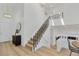Beautiful entryway featuring a stairway and modern fixtures at 1260 Ascot Ave, Highlands Ranch, CO 80126