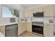 Charming kitchen with quartz countertops, modern stainless steel appliances, and recessed lighting at 1260 Ascot Ave, Highlands Ranch, CO 80126