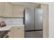 Modern kitchen showcasing stainless steel refrigerator, quartz countertops, and ample cabinet space at 1260 Ascot Ave, Highlands Ranch, CO 80126