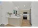 Bright kitchen featuring white quartz countertops, stainless steel appliances, and ample cabinet space at 1260 Ascot Ave, Highlands Ranch, CO 80126