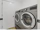 Convenient laundry room with modern washer and dryer at 1260 Ascot Ave, Highlands Ranch, CO 80126