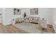Cozy living room featuring neutral-toned furniture, stylish decor, and wood-look flooring at 1260 Ascot Ave, Highlands Ranch, CO 80126
