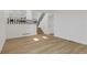 Open-concept living area with wood floors, stairway and modern design at 1260 Ascot Ave, Highlands Ranch, CO 80126