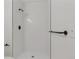 Modern shower featuring sleek fixtures and white tiles at 1260 Ascot Ave, Highlands Ranch, CO 80126