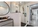 Modern bathroom with a walk-in shower and floating vanity at 6795 W 35Th Ave, Wheat Ridge, CO 80033