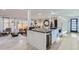 Modern kitchen with white cabinetry, large island, and stainless steel appliances at 6795 W 35Th Ave, Wheat Ridge, CO 80033