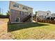 Spacious backyard with brick home, upper deck, and lush green lawn at 4816 S Elk Way, Aurora, CO 80016