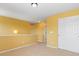 Upstairs hallway featuring bright yellow walls, carpet and closet space at 4816 S Elk Way, Aurora, CO 80016