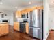 Modern kitchen featuring stainless steel appliances and light wood cabinets at 4816 S Elk Way, Aurora, CO 80016