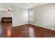 Spacious living room with hardwood floors and ample natural light at 4816 S Elk Way, Aurora, CO 80016