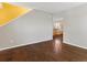 Open-concept living room featuring hardwood floors and neutral wall colors at 4816 S Elk Way, Aurora, CO 80016