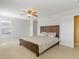 Main bedroom with a ceiling fan, a sunny window and a bed with drawers at 4816 S Elk Way, Aurora, CO 80016