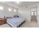Bright bedroom featuring neutral colored carpet and bedside tables at 10580 Waco St, Commerce City, CO 80022