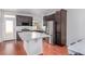 Modern kitchen boasts stainless steel appliances, granite countertops, and a functional center island at 10580 Waco St, Commerce City, CO 80022