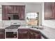 Modern kitchen boasts stainless steel appliances, granite countertops, and ample cabinet space at 10580 Waco St, Commerce City, CO 80022