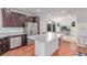 Modern kitchen boasts stainless steel appliances, granite countertops, ample cabinet space, and open concept floorplan at 10580 Waco St, Commerce City, CO 80022