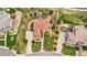 An aerial view shows an estate with a terracotta roof, manicured lawns, and lush landscaping at 7724 Kryptonite Ln, Castle Rock, CO 80108