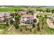 An aerial view of a home featuring a deck, fire pit, patio, and pond at 7724 Kryptonite Ln, Castle Rock, CO 80108