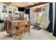 Basement bar area with bar stools, tv, bar, and mini-fridge at 7724 Kryptonite Ln, Castle Rock, CO 80108