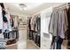Walk-in closet with custom shelving and organization, providing ample storage space for clothing and accessories at 7724 Kryptonite Ln, Castle Rock, CO 80108