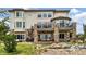 Exterior view of the house with a spiral staircase, and a water feature in the yard at 7724 Kryptonite Ln, Castle Rock, CO 80108
