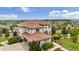 Expansive home showcasing a terracotta roof, manicured landscaping, and an attached garage at 7724 Kryptonite Ln, Castle Rock, CO 80108
