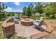 Outdoor fire pit area with seating and landscaped surroundings at 7724 Kryptonite Ln, Castle Rock, CO 80108