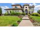 Well-manicured front yard and walkway leading to the house at 7724 Kryptonite Ln, Castle Rock, CO 80108